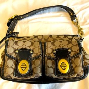 Used coach bag with colorful interior lining